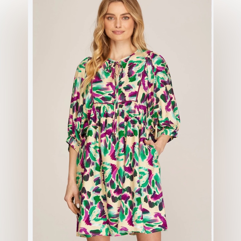 - Multi color dress with poufy 3/4 sleeves. Rich colors and has pockets. N…